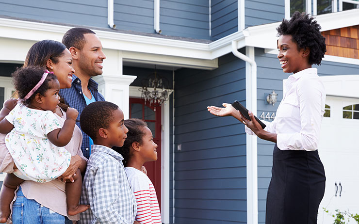 Woman shows family a home